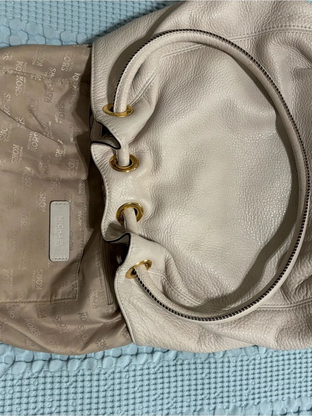Michael Kors Cream Leather Drawstring Shoulder Bag with Tassel and Gold Hardware